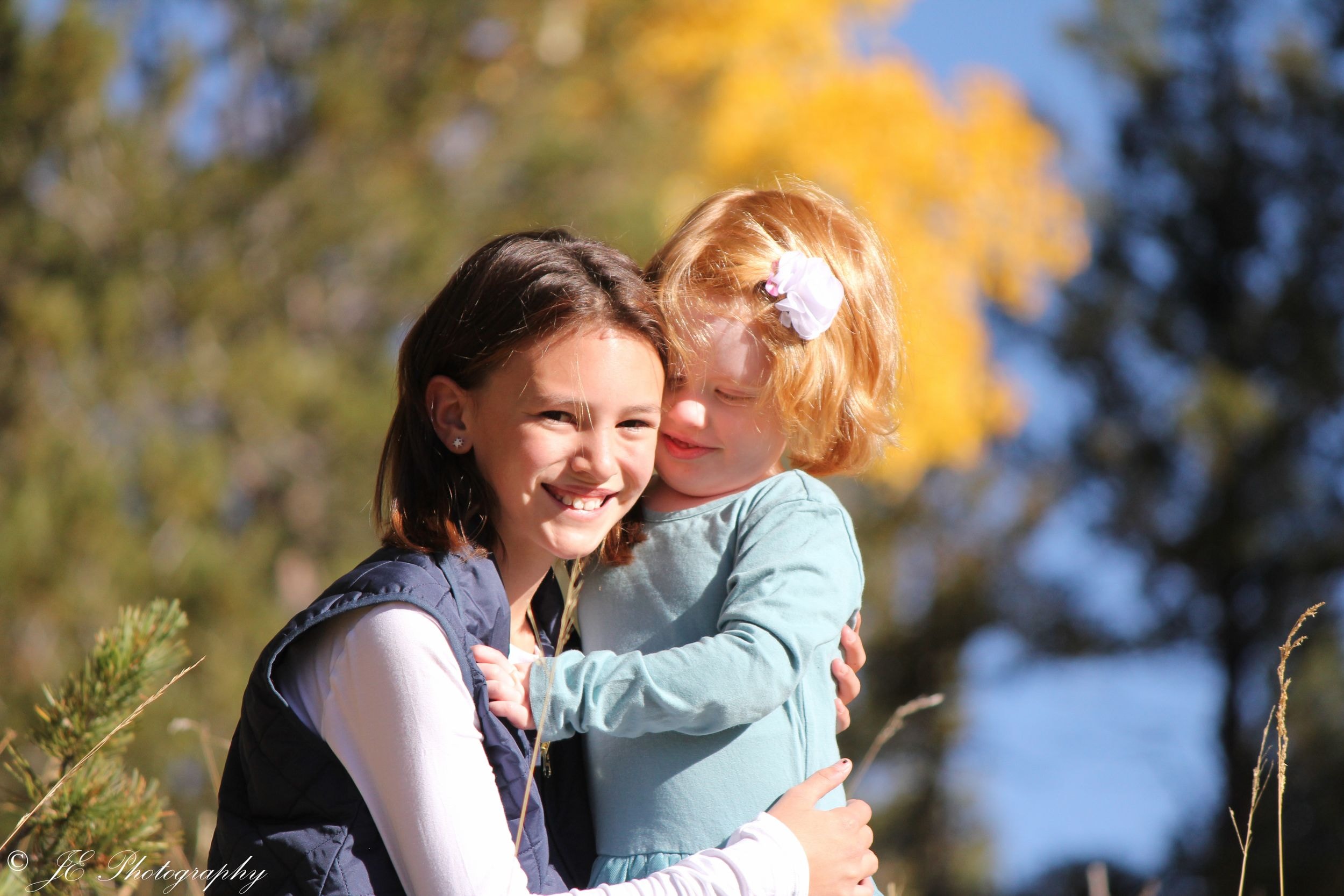 Family gathered outdoors in warm golden light